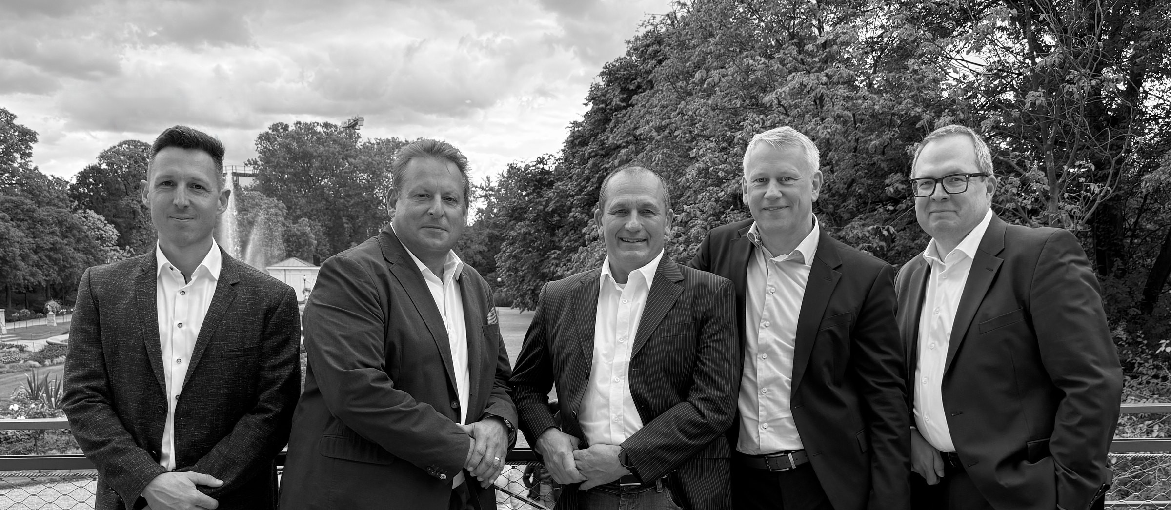 The CAPEXA partners on a terrace overlooking a park
